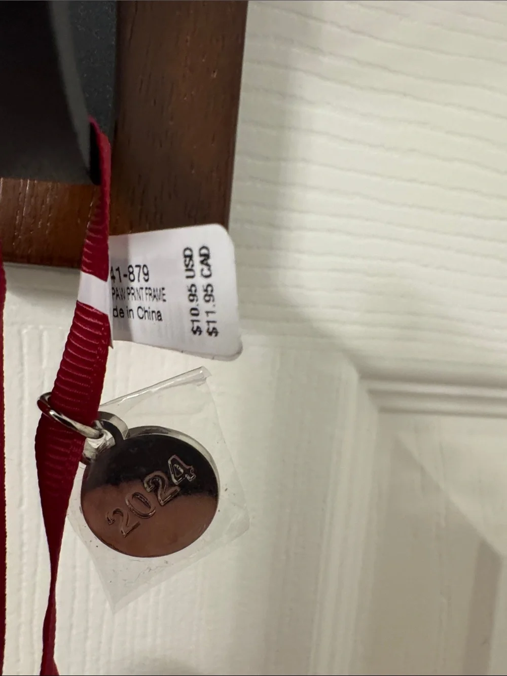 Crate&Barrel Silver Paw Ornament with Red Ribbon